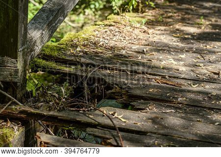 Broken Wooden Footbridge By The Lake High Angle View Close Up