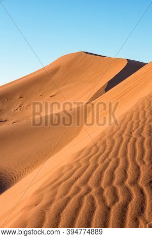 Daytime Close-up Desert Dunes Of Erg Chigaga, At Sahara. Morocco. Concept Of Travel And Adventure.