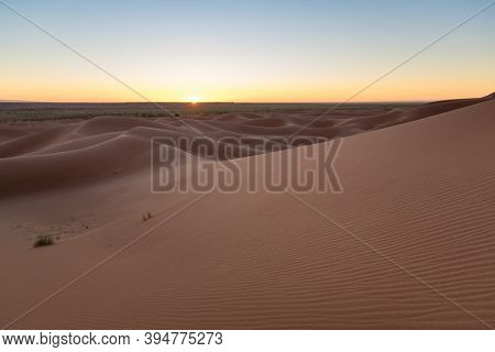 Huge Desert Dunes Of Erg Chigaga, At The Gates Of The Sahara, Al Amanecer. Morocco. Concept Of Trave