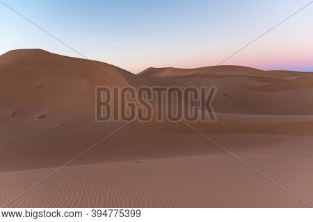 Huge Desert Dunes Of Erg Chigaga, At The Gates Of The Sahara, Al Amanecer. Morocco. Concept Of Trave