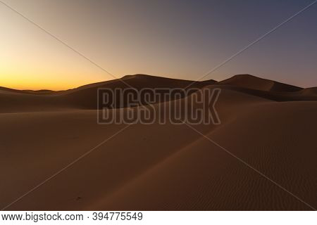 Huge Desert Dune At Erg Chigaga, Sahara. Morocco. Concept Of Travel And Adventure.