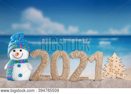 New Year 2021 And Snowman With Wooden Tree On Sea Background