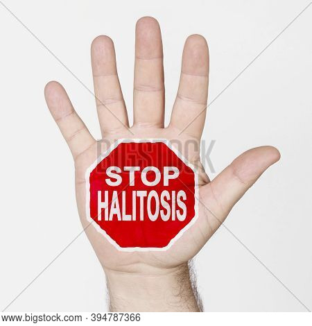 Medicine Concept. On The Palm Of The Hand There Is A Stop Sign With The Inscription - Stop Halitosis