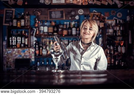 Girl Barman Creates A Cocktail In The Brasserie