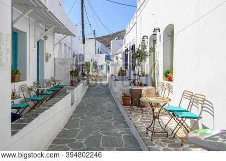Folegandros, Greece - September 23, 2020: Narrow Street With Traditional Greek Shops In Chora On Fol