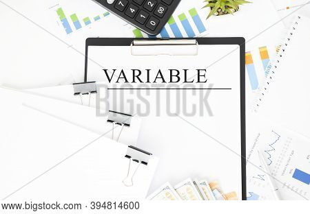 On The Tablet Is Fixed A Sheet Of Paper On It Inscription Variable, Next To The Graphics, Calculator