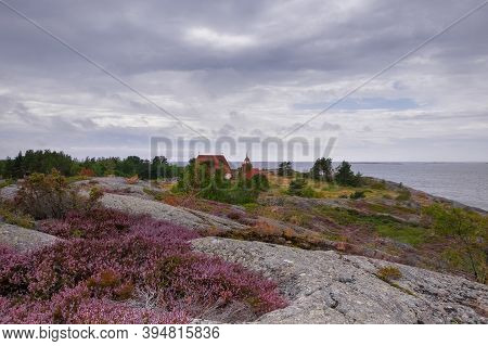 Finland, Aland Islands, Cökar, August - 2019: An Ancient Kircha But An Island Museum Among The Archi