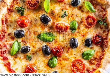 Structure Pizza With Tomatoes Mozzarella Cheese Olives And Basil - Top Pof View.
