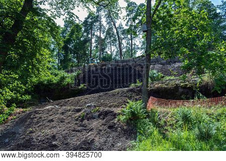 Selective Focus, Security Concept. Strengthening The Mountain Slope With Construction Equipment, Art