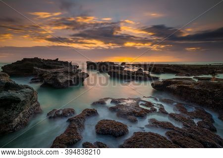 Beautiful Seascape. Long Exposure Rocky Beach During Low Tide. Panoramic Ocean View. Composition Of 