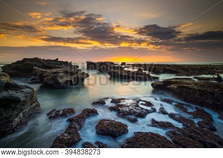 Beautiful Seascape. Long Exposure Rocky Beach During Low Tide. Panoramic Ocean View. Composition Of 