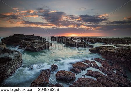 Beautiful Seascape. Long Exposure Rocky Beach During Low Tide. Panoramic Ocean View. Composition Of 