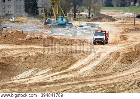 Multi-ton Heavy Mining Dump Truck Loaded With Cargo During Removal Of Construction Soil From Constru