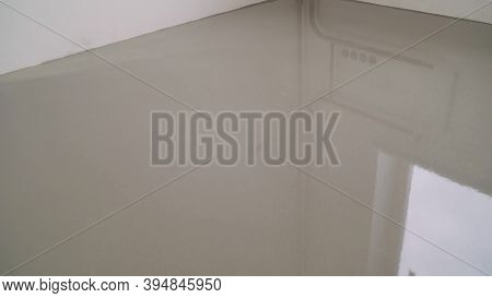 Self-leveling Floor In The New Room. A New Self-leveling Floor Is Poured Into The Room