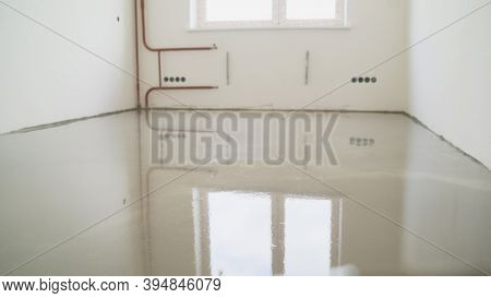 Self-leveling Floor In The New Room. A New Self-leveling Floor Is Poured Into The Room
