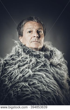 Solid Middle-aged Man In A Fur Mantle