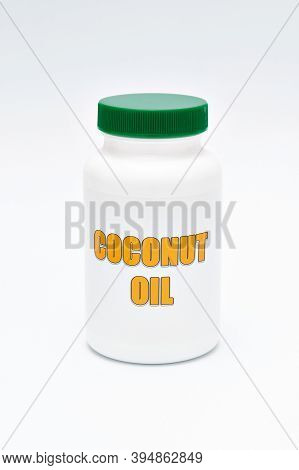 Health Care - Nutritional Supplement - Bottle Of Coconut Oil. Isolated On A White Background. Vertic