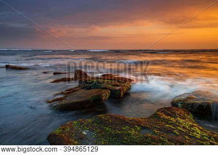 Beautiful Seascape. Beach With Stones Covered By Seaweeds. Low Tide. Composition Of Nature. Motion W