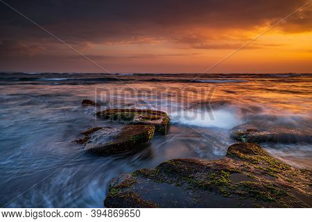 Beautiful Seascape. Beach With Stones Covered By Seaweeds. Low Tide. Composition Of Nature. Motion W