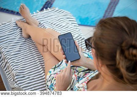 Alanya, Turkey - November 2, 2020: Woman Hand Holding Iphone 11 With Application Booking.com Online 
