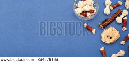 Variety Of Dog Treats. Dod Delicacy Food On Blue Background