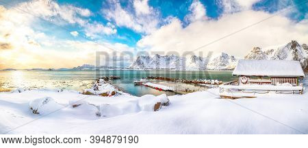 Wonderful Winter Scenery With Wooden Houses In Small Fishing Village And Snowy  Mountain Peaks Near 