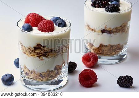 Glasses Of Yogurt And Muesli With Fresh Fruit