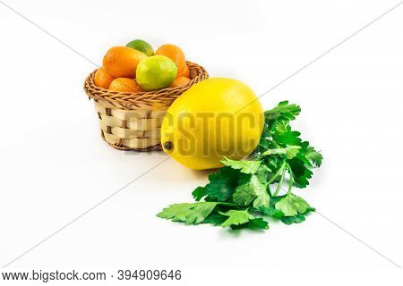 Wicker Basket With Kumquats Limequats, Exotic Citrus Fruits In Winter On White Isolated Background W