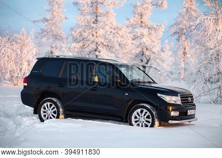 Novyy Urengoy, Russia - November 14, 2020: Black Luxury Offroad Car Toyota Land Cruiser 200 In The S