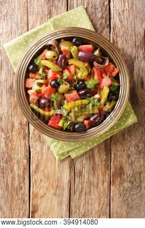 Tomato And Green Pepper Salad Chlada Felfel Recipe Close-up In A Bowl. Vertical  Top View