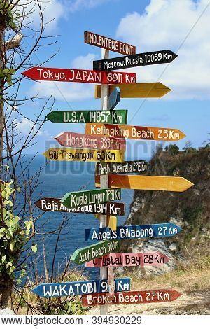 Colorful Wooden Sign With The Names Of Landmarks And Distances In Rumah Pohon Molenteng View Point, 