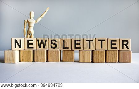 'newsletter' Written On Wood Blocks. Wooden Mannequin, Model Of Human. Business Concept. Copy Space.