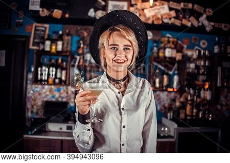 Girl Barman Concocts A Cocktail In The Pothouse