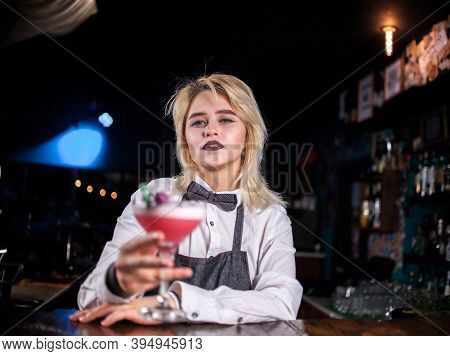 Young Girl Bartender Demonstrates The Process Of Making A Cocktail