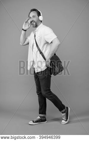 The Headphones He Is After. Happy Man Wear Headphones Grey Background. Mature Adult Listen To Music 