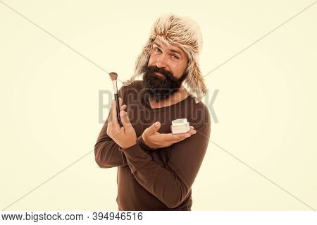 Professional Cosmetics. Applying Makeup Face Tone. Powder Cosmetics. Man Bearded Stylist Wear Hat Ho