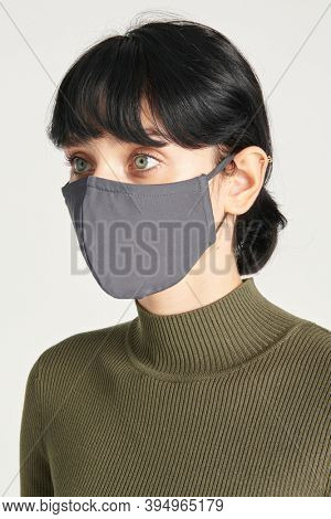 Face mask mockup on a women in a green turtleneck top