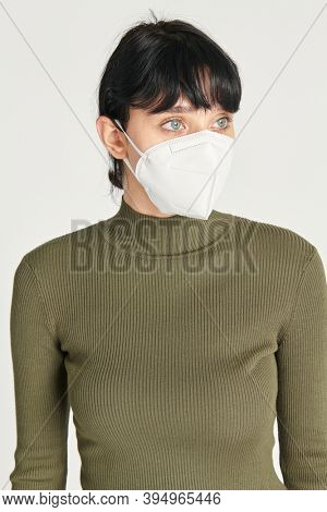Face mask mockup on a women in a green turtleneck top