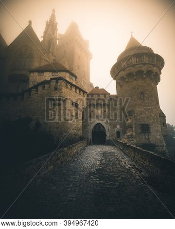 Castle Kreuzenstein In Austria During Autumn On A Foggy Morning