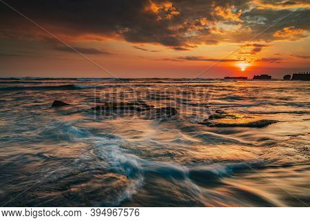 Beautiful Seascape. Sunset Scenery Background. Moving Waves. Low Tide At The Beach. Composition Of N