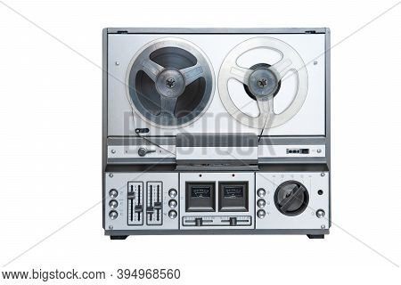 Stereo Tape Deck Recorder Player With Reels On Background.
