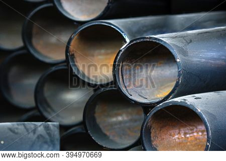 Black Metal Pipes And Adapters Of Different Diameters For Gasification Or Water Supply. Industrial B
