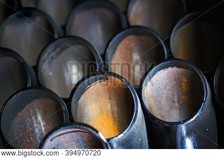 Black Metal Pipes And Adapters Of Different Diameters For Gasification Or Water Supply. Industrial B