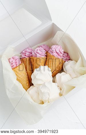 Double Layered Zefir And Zefir In A Waffle Cone In A Box Over White