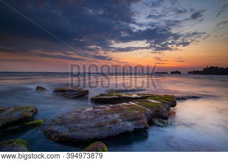Calm Ocean Long Exposure. Stones In Mysterious Mist Of The Sea Waves. Concept Of Nature Background. 