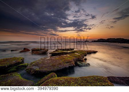 Calm Ocean Long Exposure. Stones In Mysterious Mist Of The Sea Waves. Concept Of Nature Background. 