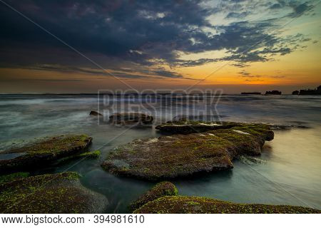Calm Ocean Long Exposure. Stones In Mysterious Mist Of The Sea Waves. Concept Of Nature Background. 