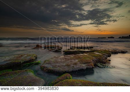 Calm Ocean Long Exposure. Stones In Mysterious Mist Of The Sea Waves. Concept Of Nature Background. 