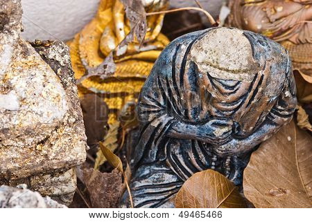 Old Headless Budda Statue In Open Space.