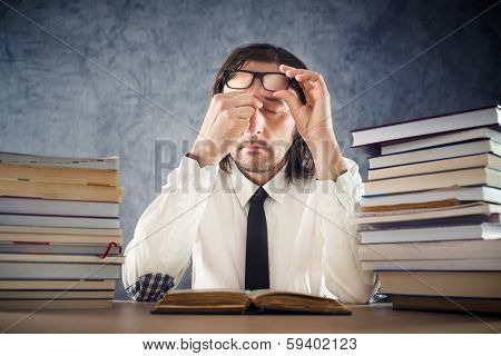 Exhausted Man Reading Books